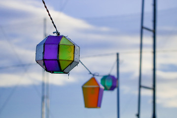 Modern Lantern hanging on the line of cable crossing the festival court