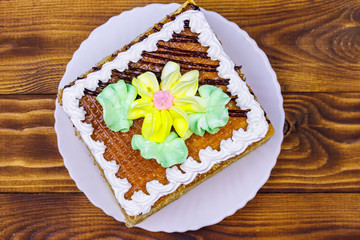 Tasty sweet cake on a wooden table. Top view