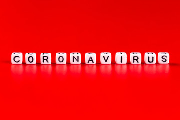 Pandemic and virus concept - Coronavirus word made of white blocks. Coronavirus text on red background.