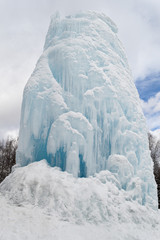 Freaks of nature. Huge icicle formed around a source of artesian water