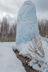 Freaks of nature. Huge icicle formed around a source of artesian water