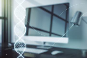 Double exposure of creative DNA hologram on laptop background. Bio Engineering and DNA Research concept