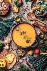 Peel and stick wall murals Food Vegan diet. Autumn harvest. Healthy, clean food and eating concept. Zero waste. Pumpkin soup with vegetarian cooking ingredients, wooden spoons, kitchen utensils on wooden background. Top view