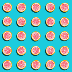 blue background with red lemon circles, top view, close-up, pattern