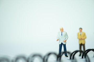 Miniature people: Businessman with copy space for text using as background saving, investment, money, financial, business analytics concept.