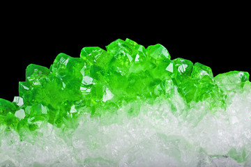 bright green emerald crystals closeup on black