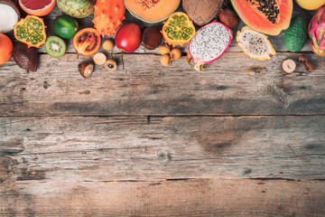 Assortment of tropical fruits concept. Exotic fruits - pineapple, papaya, mango, annona, banana, pitahaya, kiwano, african horned melon, tamarillo fruit, granadilla, salak, snake fruit, maracuya
