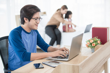 Businessman working from home in bedroom