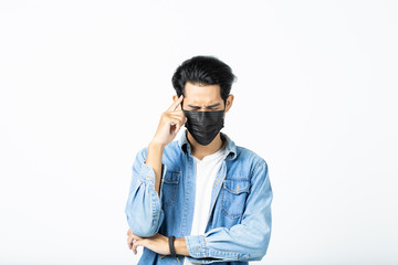 Asian young man with light hair in a medical protective mask, Coronavirus and Air pollution pm2.5 concept.