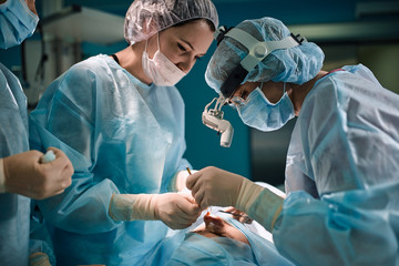 A shot of an emergency and a serious accident in the operating room, a team of surgeons makes an emergency operation to people in an accident. Saving lives, modern medetsina.