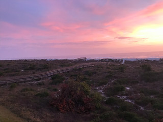 ocean sunset pink skies boardwalk pier