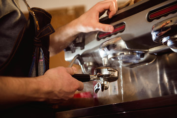 close up barista hand making a cup of coffee