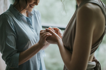 Fototapeta premium two friendly soulmates sisters holding eachother hands. bride getting prepared for the wedding