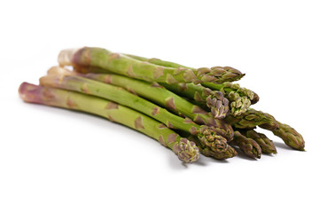 Bunch of raw green asparagus isolated on white background