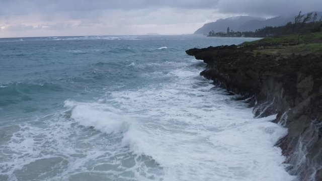 Beautiful Hawaii Scenery & Jagged Ocean Cliffs at Pounders Beach, Aerial Drone