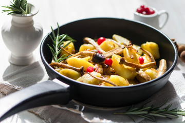 delicious fried potatoes with mushrooms, onions and cranberries