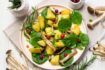 delicious fried potatoes with mushrooms, onions and cranberries