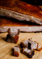 Oriental Roast Pork Belly on wooden chopping board