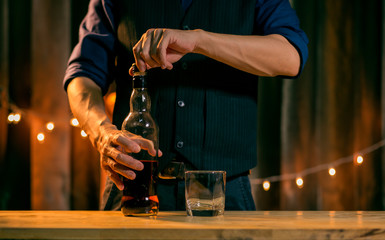 Barman pouring whiskey whiskey glass beautiful night