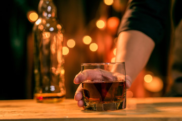 Barman pouring whiskey whiskey glass beautiful night