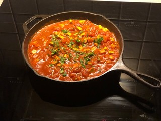 Vegan Indian tofu and tomato stew with chili and turmeric