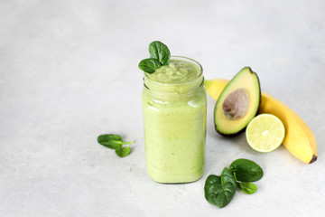 Smoothies with banana, avocado, spinach, lime