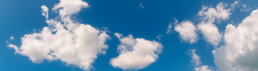Panorama blue sky fluffy white cloud summertime on light sunny day cloudscape. Clear bright blue skyline sunlight climate panoramic background. Heaven blue environment ecology scenic nature background