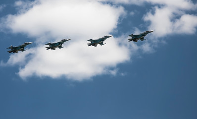 Fototapeta na wymiar 4 aircraft in the sky against a cloud