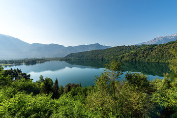 Fototapeta na wymiar Lago di Levico, small beautiful lake in Italian Alps, Levico Terme town, Valsugana valley, Trento province, Trentino Alto Adige, Italy, Europe