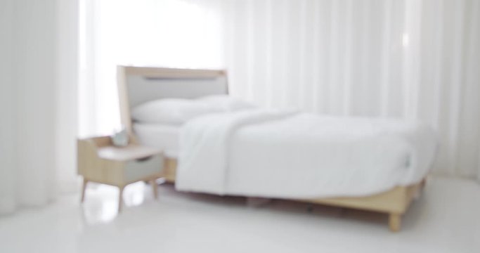 Blurred background with bed in bedroom