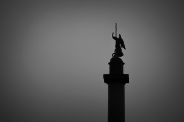 Fototapeta premium Dark silhouette of a statue against the sky