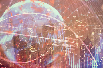Fototapeta premium Double exposure of forex chart drawings over cityscape background. Concept of success.