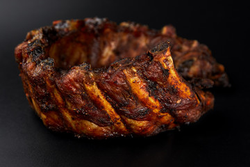 meat ribs on black background