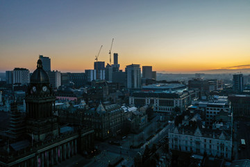 Aerial photo of a beautiful sunrise rising over the town of Leeds in West Yorkshire UK.