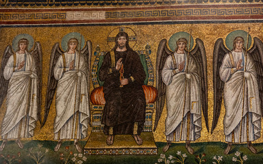 Mosaic of the enthroned Christus with four vanguard angels in Basilica of St Apollinare Nuovo in...