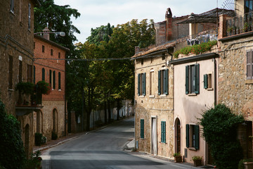 Fototapeta na wymiar Medieval street in old Italian hill town. Tuscany, Italy