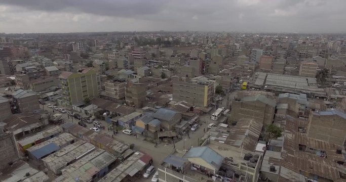 Aerial footage flying over low-rise residential neighborhoods in Umoja and skyline Nairobi Kenya, changing urban landscapes Kenya Africa
