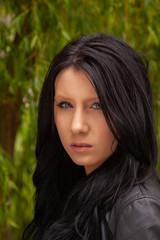 Young woman outside wearing a black leather jacket