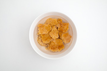 nurungji and warm water in a round bowl. crispy rice crust. Korean name Nurungji.