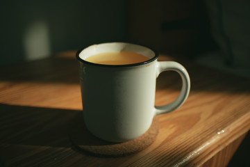 Fresh orange drink on wooden tea table in the morning.