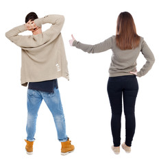 Back view of couple in sweater showing thumbs up.