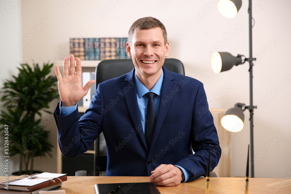 Poster man using video chat in office, view from web camera