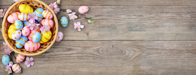 Fototapeta na wymiar Gift card with colorful easter eggs on old wooden table.