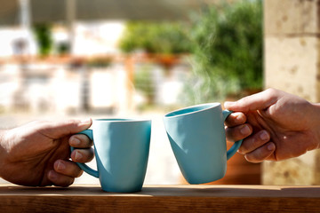 Mug of hot drink and hands.Morning time and free space for your decoration. 