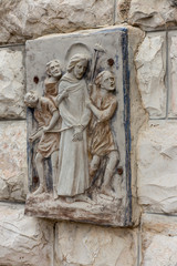 A bas-relief on the wall in the Olive Garden in Jerusalem, Israel. Jesus restrained, captured and guided