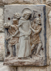 A bas-relief on the wall in the Olive Garden in Jerusalem, Israel. Jesus restrained, captured and guided