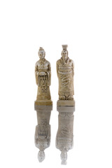 White vintage king and queen chess isolated on white background with reflection on the floor
