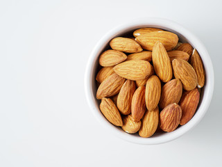 Almond nuts isolated on white background.