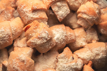 sweet homemade bagels, small in size, with jam sprinkled with icing sugar