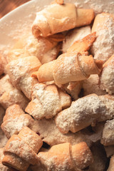 sweet homemade bagels, small in size, with jam sprinkled with icing sugar